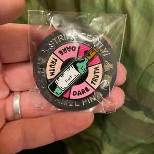Brand New In Packaging Strike Gently Deluxe Spinning Truth or Dare Enamel Pin